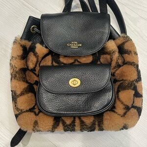 Coach X Jennifer Lopez Pennie Backpack 22 in signature Shearling.